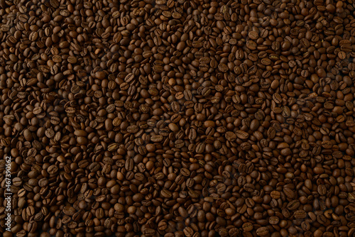Coffee beans, texture. Background made of natural coffee beans, top view