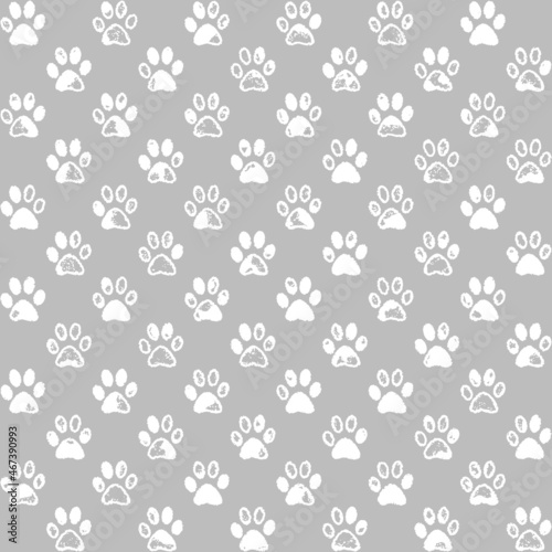 Paw prints in white and gray, a seamless background pattern