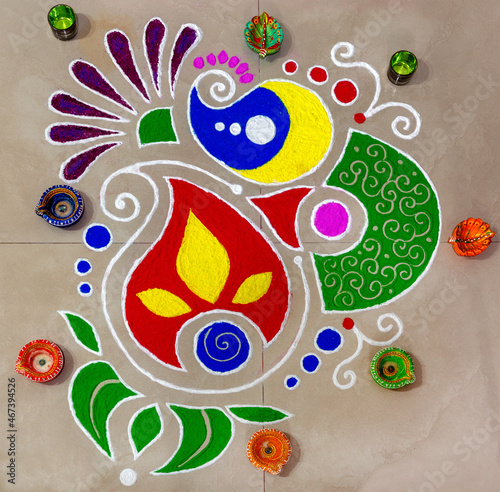 Colourful rangoli with deepak photo