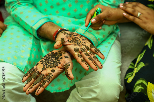 Closeup shot of Heena design on a female hand photo