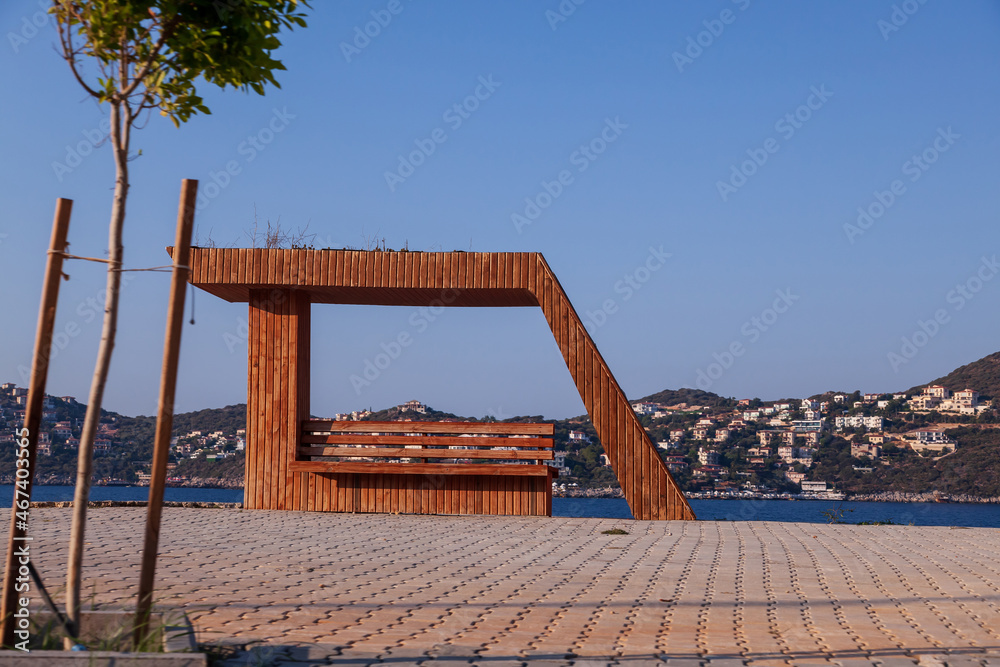 Modern wooden bus stop with a beautiful design next to the seaside in Turkey