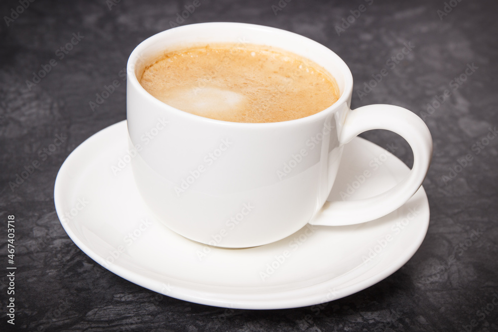 Cup of coffee with milk on dark background Cup of coffee with milk on dark background