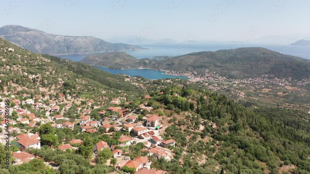 Drone view of Vathi port over Perachori village on the mountain in Ithaca Greece Drone view of Vathi port over Perachori village on the mountain in Ithaca Greece