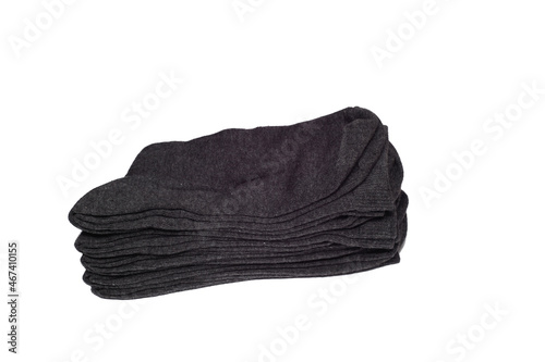 Men's socks are dark and rolled up. on an isolated white background. stacked, rolled up 