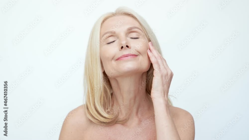 Retired grandma apply anti age facial tonic enjoy rejuvenating effect Retired grandma apply anti age facial tonic enjoy rejuvenating effect