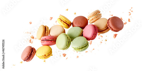 Fotografie French  sweet colorful  mixed cookies macarons macaroons with crumbs flying isol