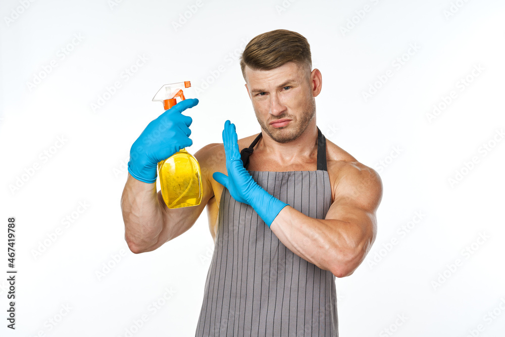 man in apron detergent cleaning service light background man in apron detergent cleaning service light background