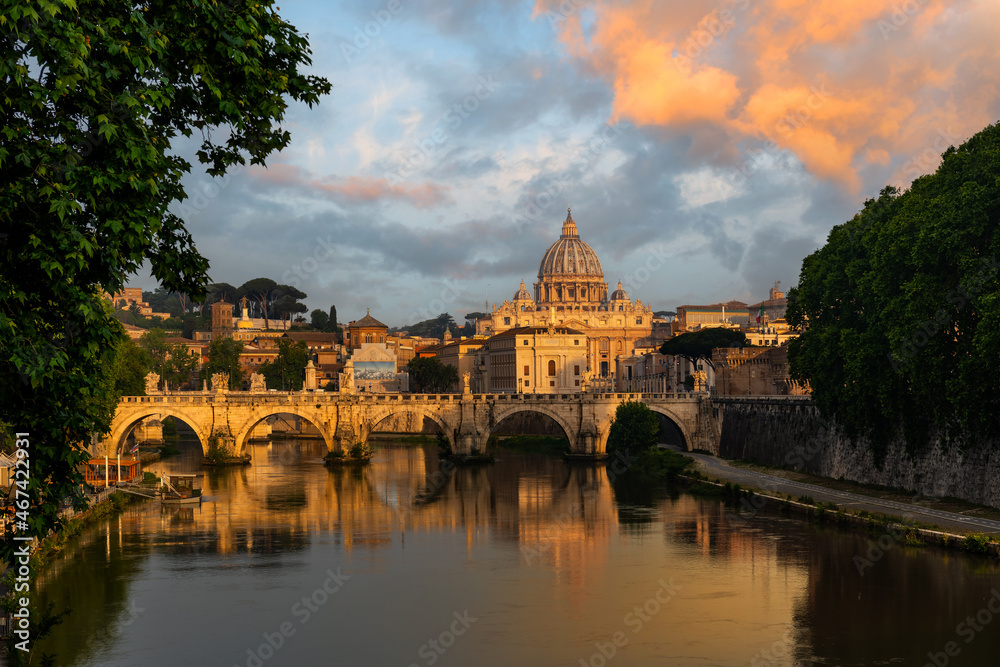 Tiber River, Saint Angel's Bridge and Saint Peer's Basilica in the early morning under the expressive sky