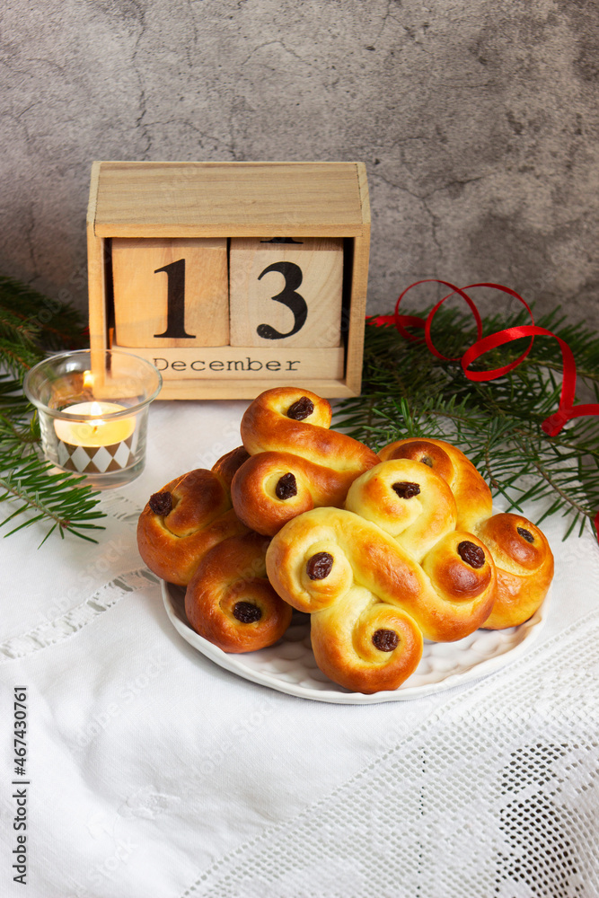 Traditional Swedish saffron buns of various shapes on a light background.