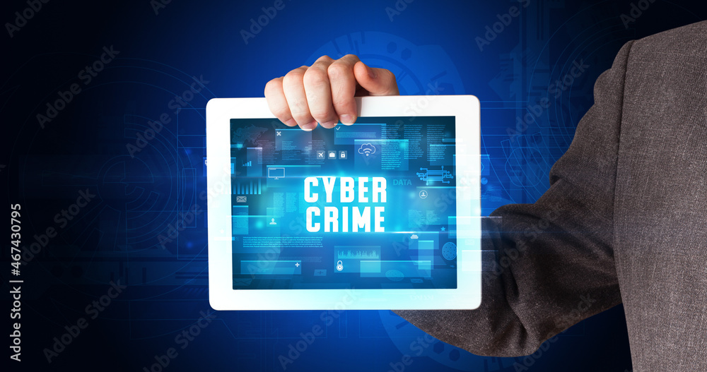 Person holding tablet, security concept Person holding tablet, security concept