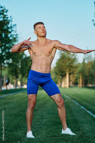 man doing exercises in the park inflated body
