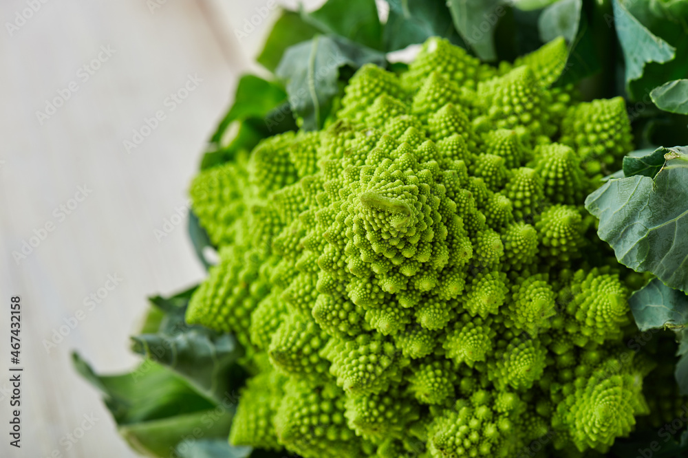Fresh romanesco cauliflower on the white wooden background. Fresh romanesco cauliflower on the white wooden background.