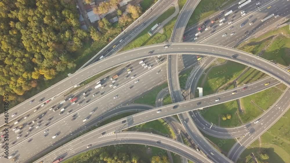 The drone flies beautifully over a multi-level intersection and shows the movement of cars The drone flies beautifully over a multi-level intersection and shows the movement of cars