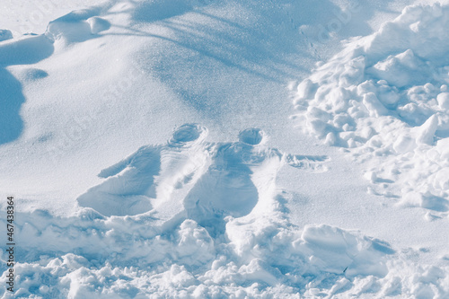 Imprint of person body on snow. Figure in snow from two bodies of man and woman. © yrabota