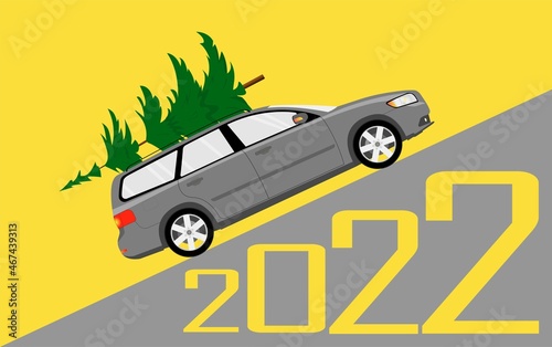 Fotografie A passenger car carries a Christmas tree for Christmas and New Year