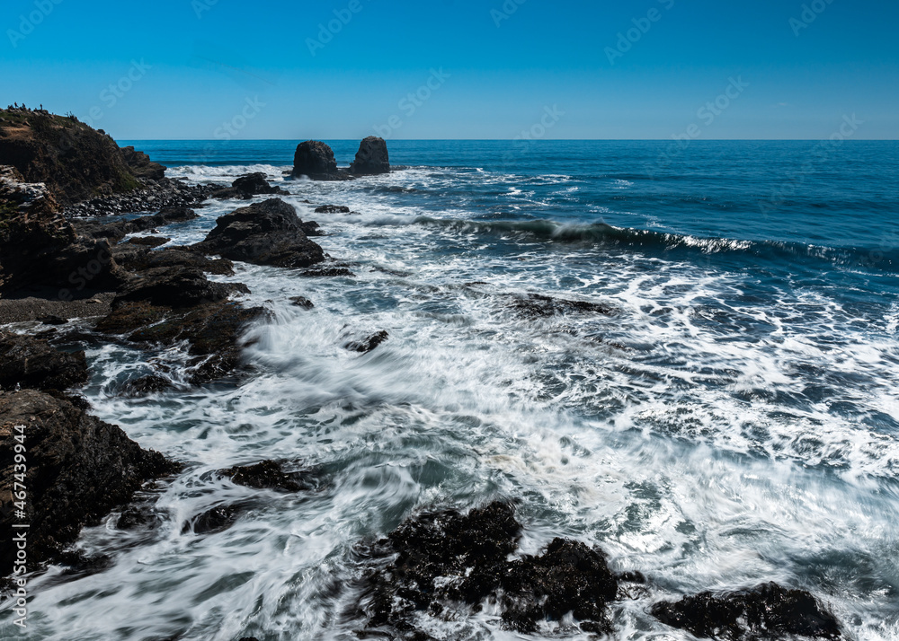 Panoramic view of the coast of punta de lobos on a sunny day.