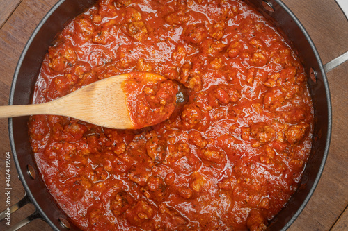 Close up of pasta sauce with sausage in the pot