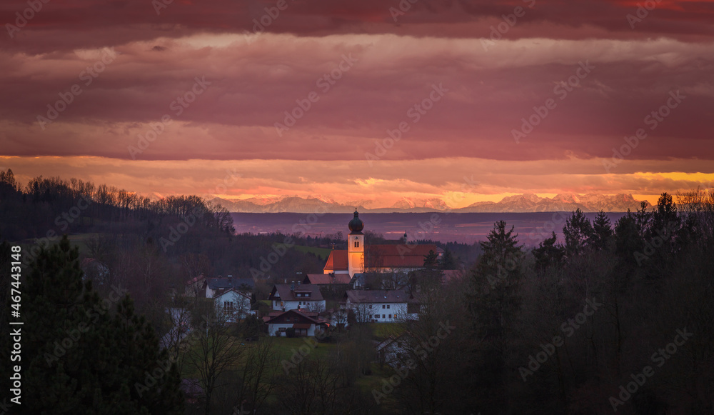 Grafling Sunset with a view on St Andreas Church and the Bavarian Alps in the far distance