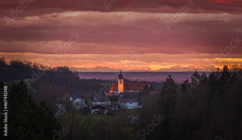 Grafling Sunset with a view on St Andreas Church and the Bavarian Alps in the far distance