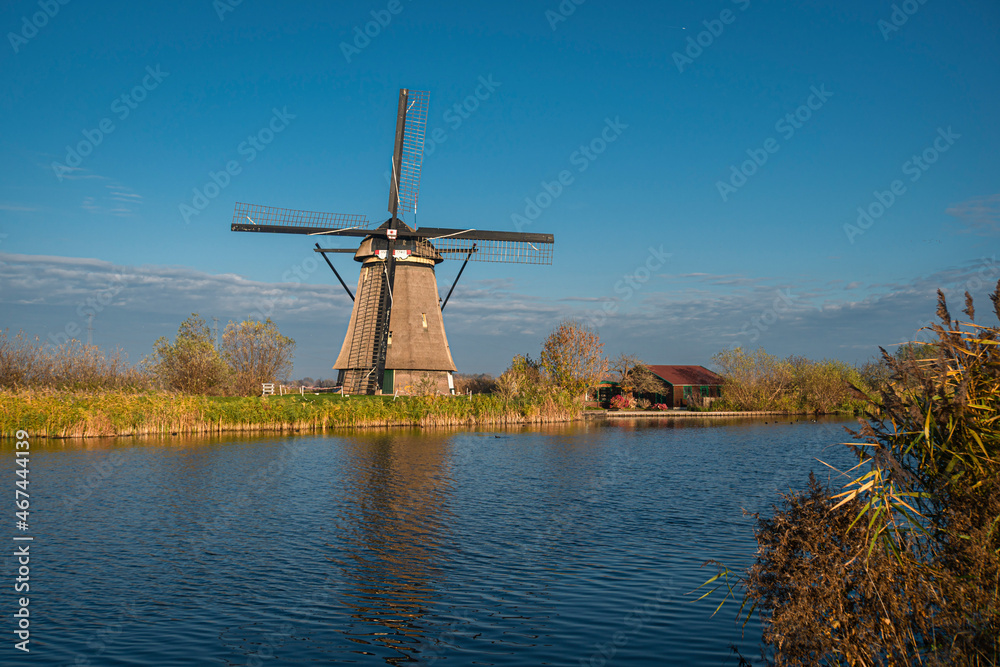 Ancient windmill on the edge of the canal at Kinderdijk, Netherlands