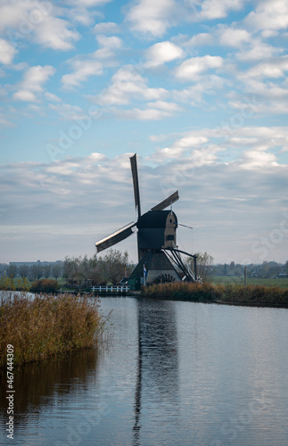 Ancient windmill on the edge of the canal at Kinderdijk, Netherlands