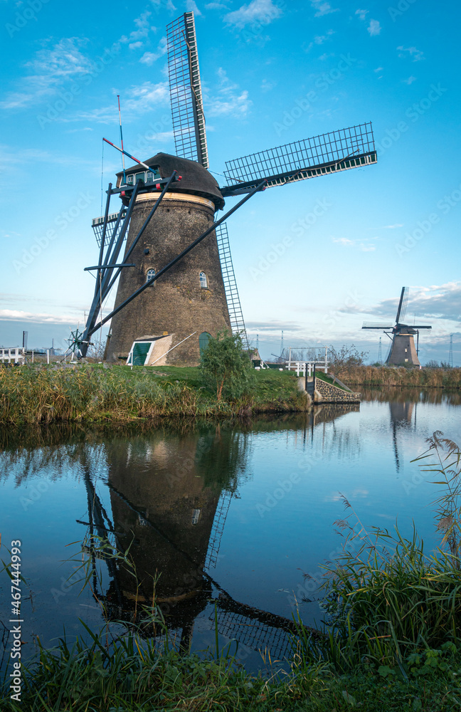 Ancient windmills on the edge of the canal at Kinderdijk, Netherlands