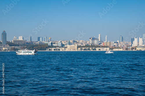 Bosphorus, the Strait of Istanbul, landscape view with Dolmabahce Palace and Istanbul skyline in the background. © uskarp2