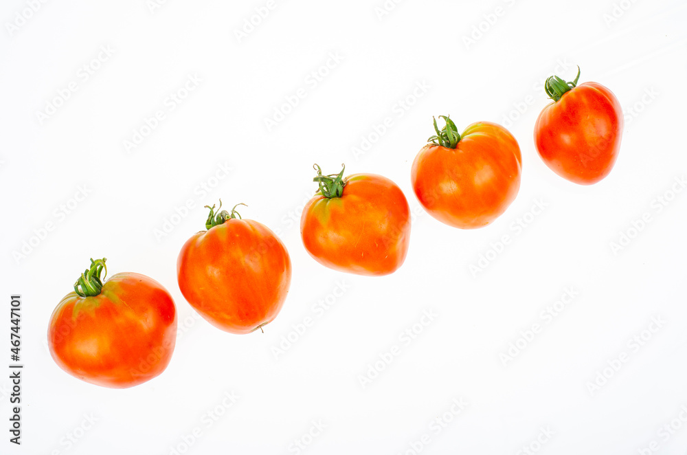 Red tomatoes in shape of heart on white background. Studio Photo Red tomatoes in shape of heart on white background. Studio Photo