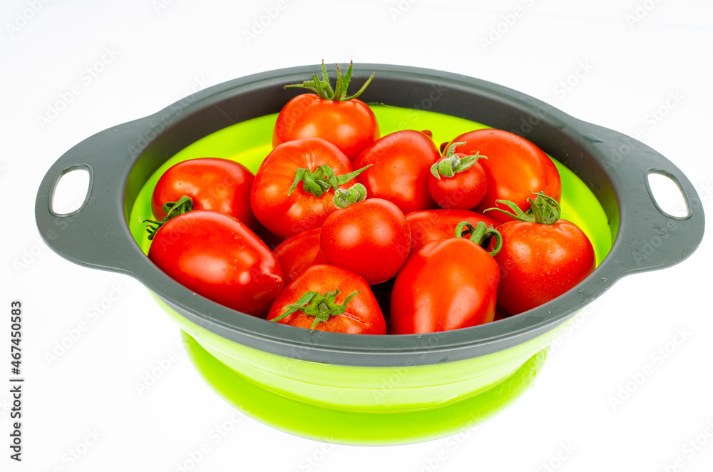 Red ripe oval tomatoes. Studio Photo. Red ripe oval tomatoes. Studio Photo.