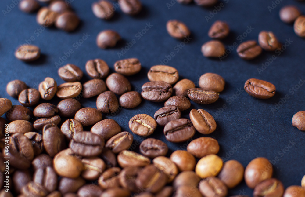 roasted aromatic coffee beans on a dark background. coffee background. flat lay with place for text. view from above.
roasted aromatic coffee beans on a dark background. coffee background. flat lay with place for text. view from above.