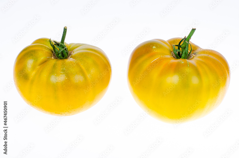 Fresh yellow tomatoes isolated on white background. Studio Photo. Fresh yellow tomatoes isolated on white background. Studio Photo.