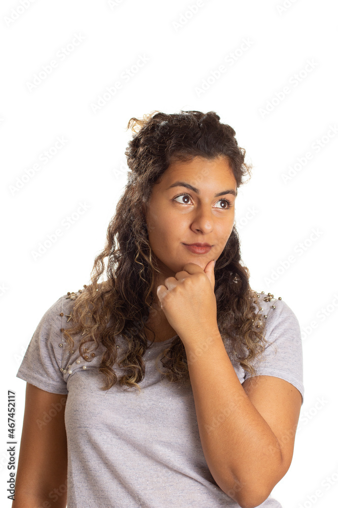 Black curly hair girl looking to the side and thinking dreaming unsure of the future. Isolated on white background. Black curly hair girl looking to the side and thinking dreaming unsure of the future. Isolated on white background.