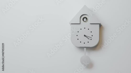 Beautiful view of grey wall cuckoo clock on colorful background. Sweden. photo