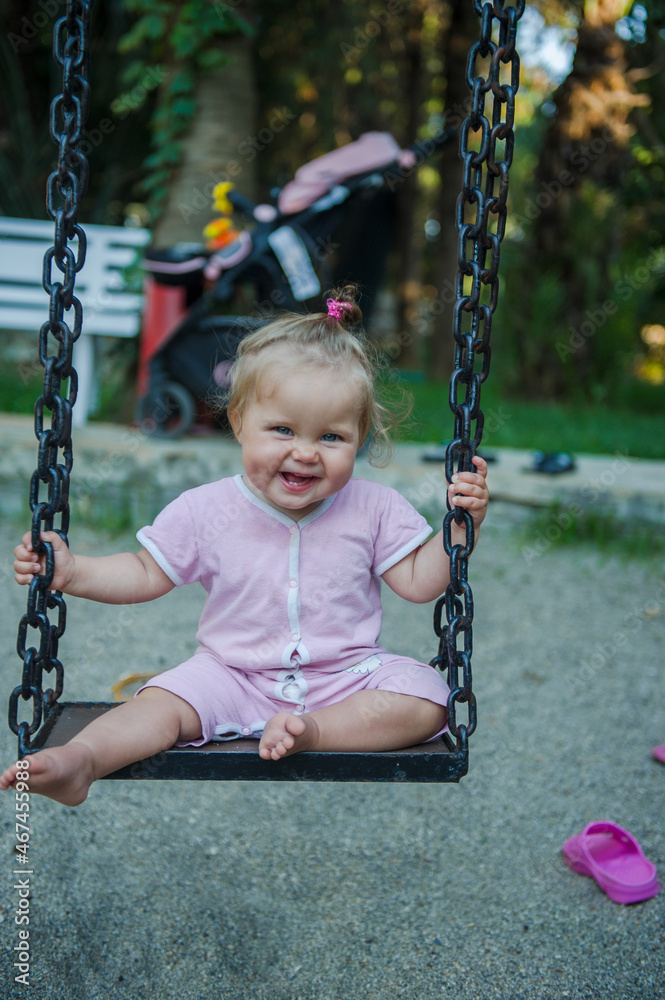 little girl on swing