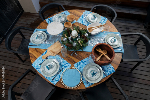 Wooden table with Christmas decorations on a terrace for Christmas dinner in Mexico