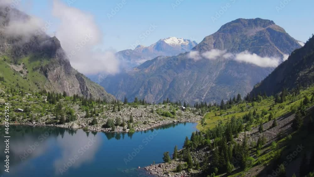 Aerial fly over above the lac Lauvitel in the French alps during summer Aerial fly over above the lac Lauvitel in the French alps during summer