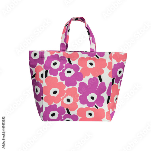Colorful floral tote bag isolated on white background.
