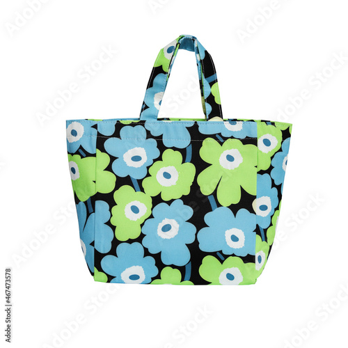 Colorful floral tote bag isolated on white background.