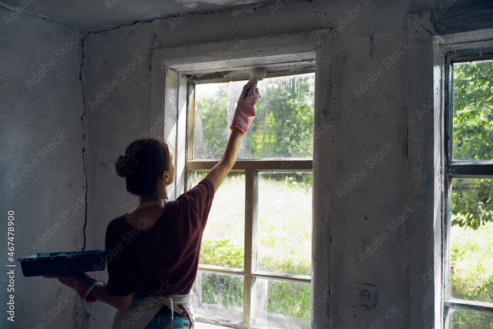 Fototapeta premium woman house painter paint wall home renovation decoration
