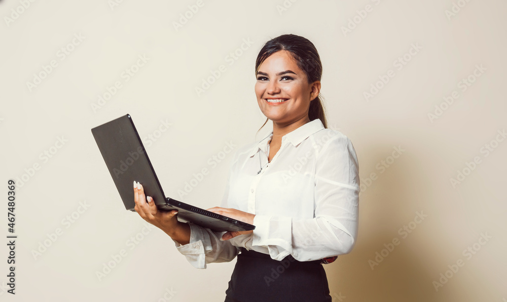 Cheerful hispanic young woman using a laptop computer equality concept. Cheerful hispanic young woman using a laptop computer equality concept.