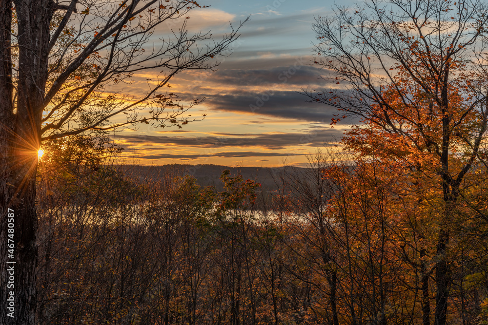 Palmerston Lake Sunset over the tree line in Autumn Palmerston Lake Sunset over the tree line in Autumn