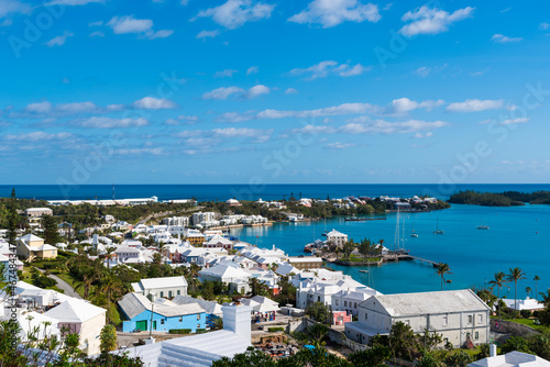 Bermuda's Coastal Symphony: Where azure waters meet vibrant skies, lush landscapes cradle charming houses, creating a harmonious island masterpiece.