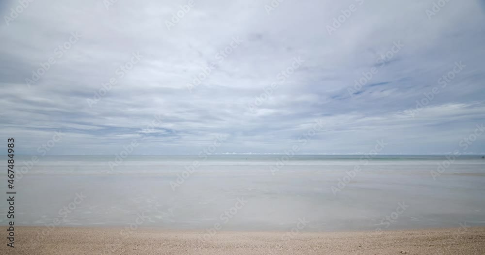 timelapse the beach with white sand and wave from peaceful sea in sunshine daytime timelapse the beach with white sand and wave from peaceful sea in sunshine daytime