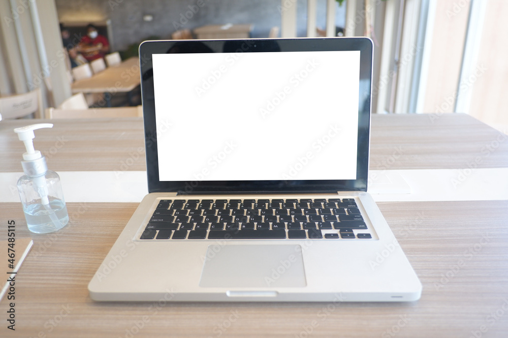 Fototapeta premium Cropped shot view of the labtop with blank copy space screen for your information content or text message on the gray granite at the modern place