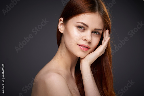 woman with bare shoulders and beautiful hairstyle close-up attractive look