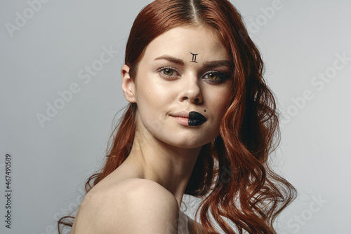 red-haired woman naked shoulders cosmetics horoscope close-up