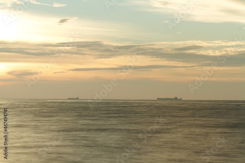 horizon from the seashore during golden hour in the evening