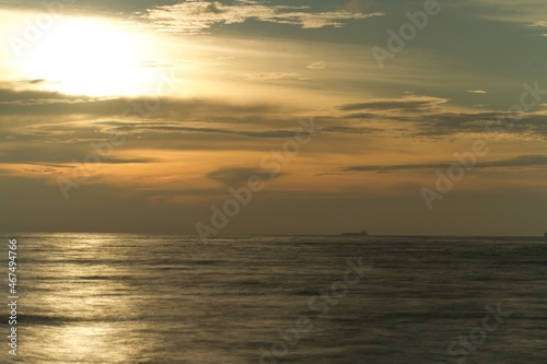 horizon from the seashore during golden hour in the evening