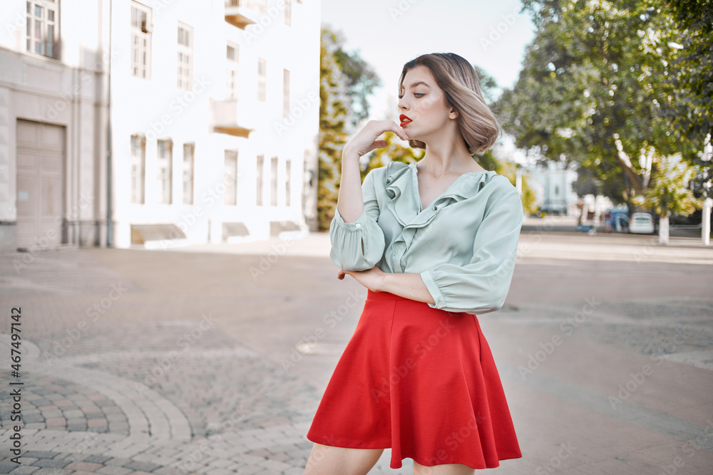 Fototapeta premium pretty woman attractive look red lips walk in the park lifestyle