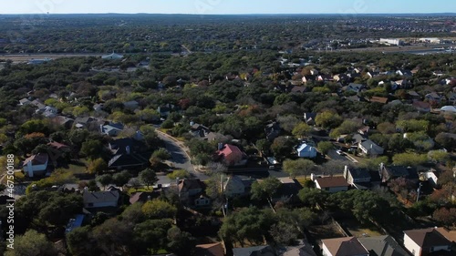 Drone footage of neighborhoods, homes, and streets in San Antonio, Texas.